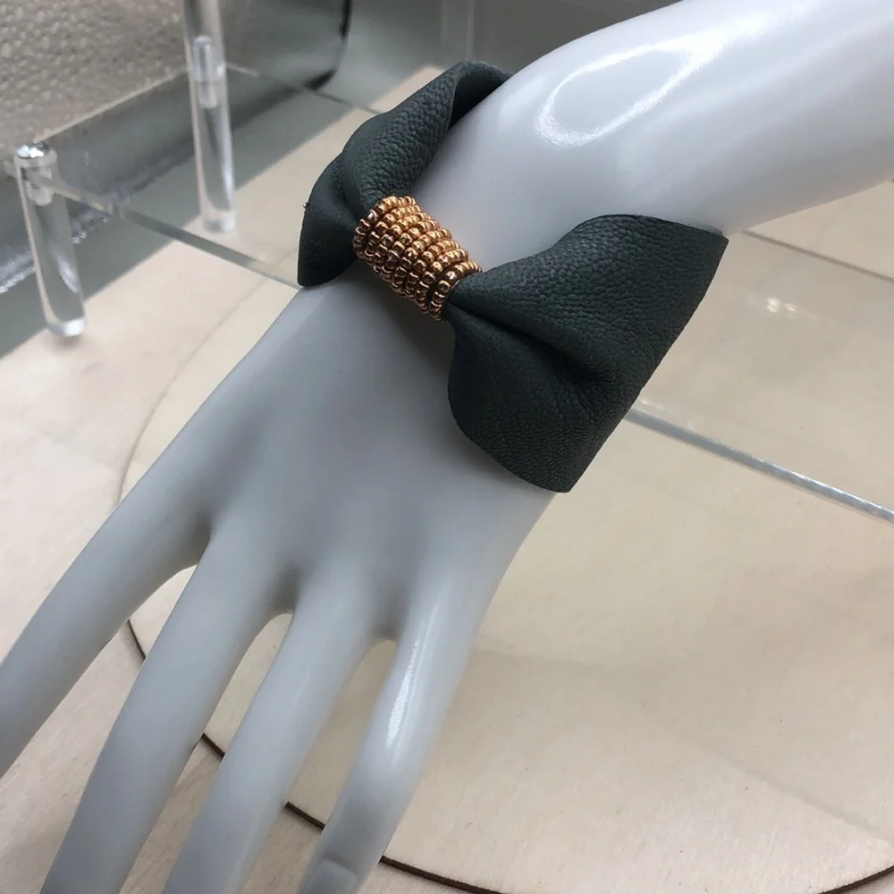 Soft leather bow shaped bracelet.